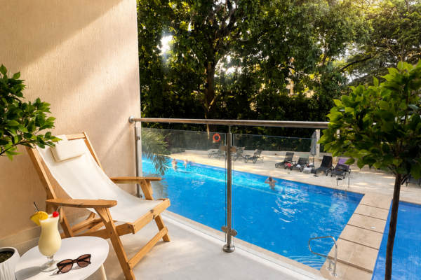 Private balcony overlooking the pool at KAIA Jacó